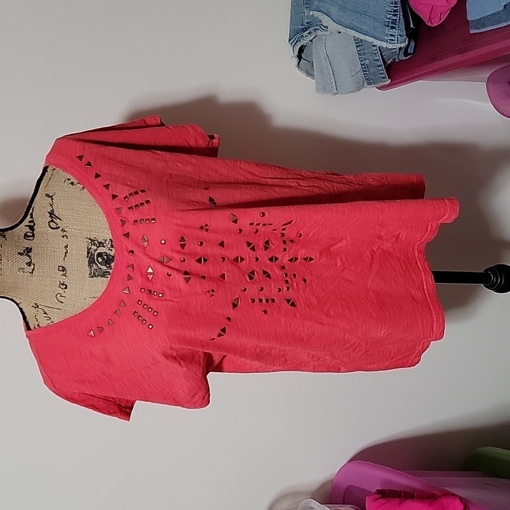 2x orange/red tshirt with embellishments on the front.